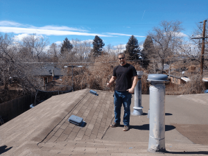 Professional Middletown roofing service inspecting a roof for winter readiness