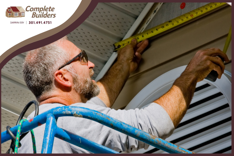 Complete Builders team installing eco-friendly siding in Maugansville.
