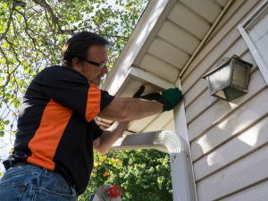 Complete Builders team installing siding on a Maugansville home