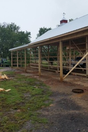 Workers repairing residential roof