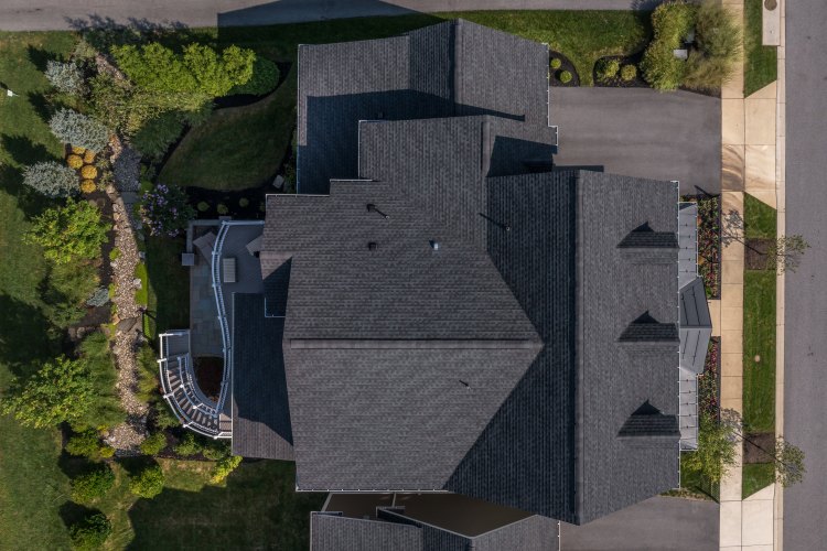 Workers repairing residential roof
