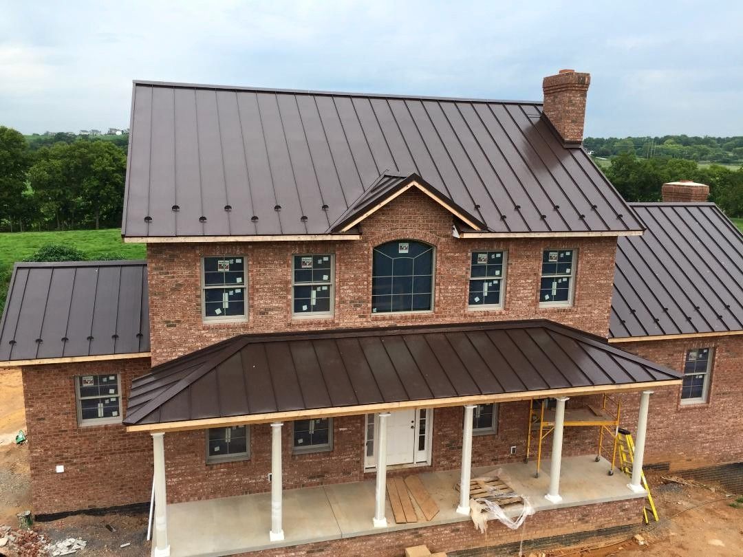 Workers repairing residential roof
