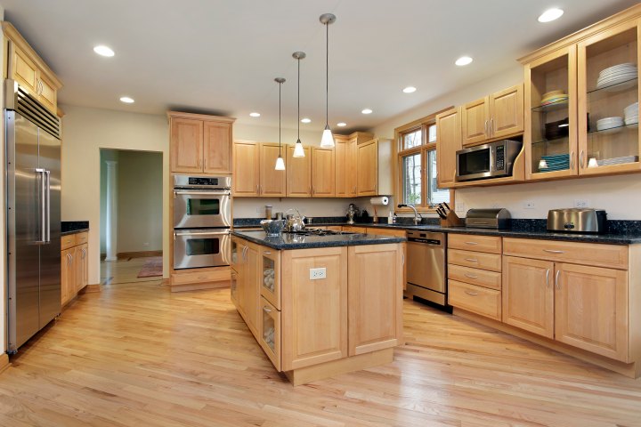 Workers repairing residential roof